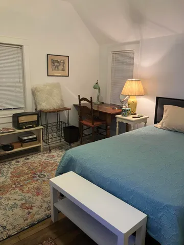 a room with furniture and a flat screen tv