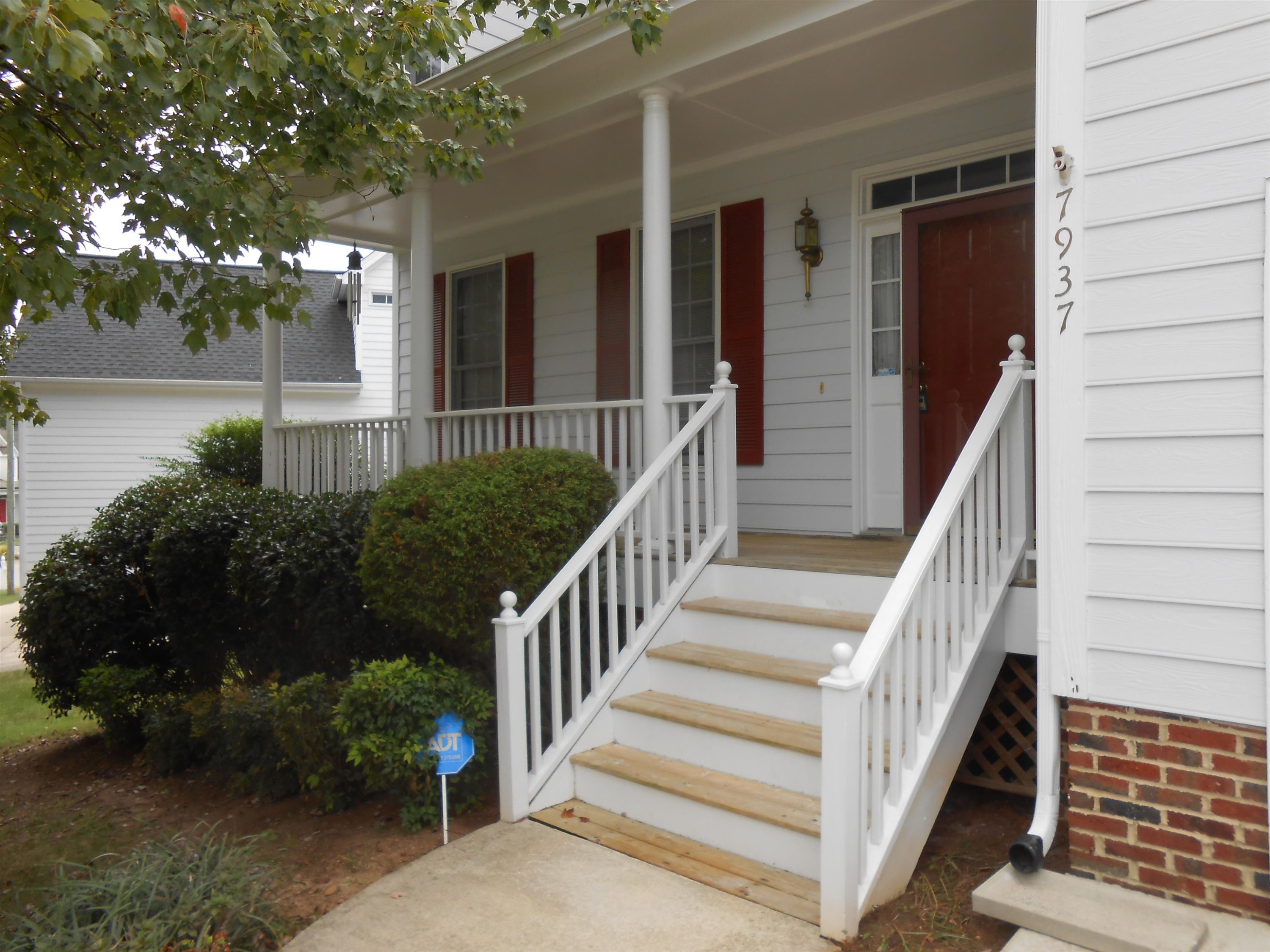 7937 Milltrace Run Raleigh, NC 27615 - Photo 3 of 34 a view of a house with a yard