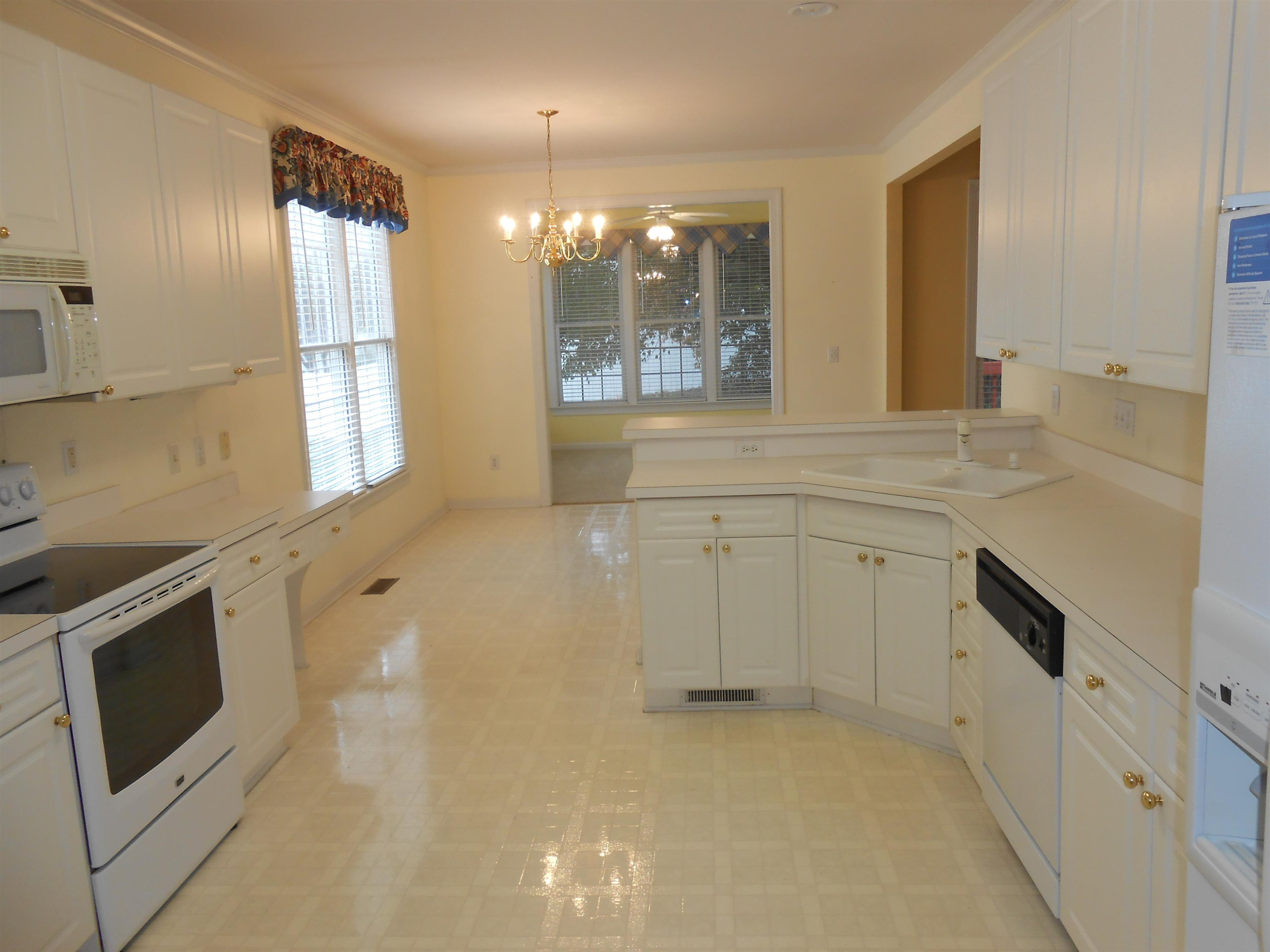 7937 Milltrace Run Raleigh, NC 27615 - Photo 8 of 34 a spacious bathroom with a sink double vanity and a mirror