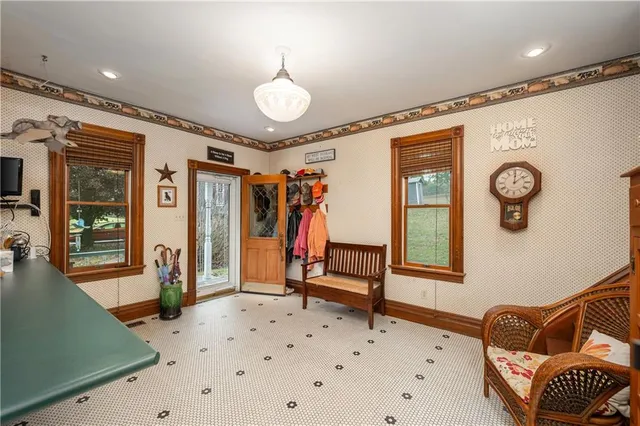 a bedroom with furniture and a window