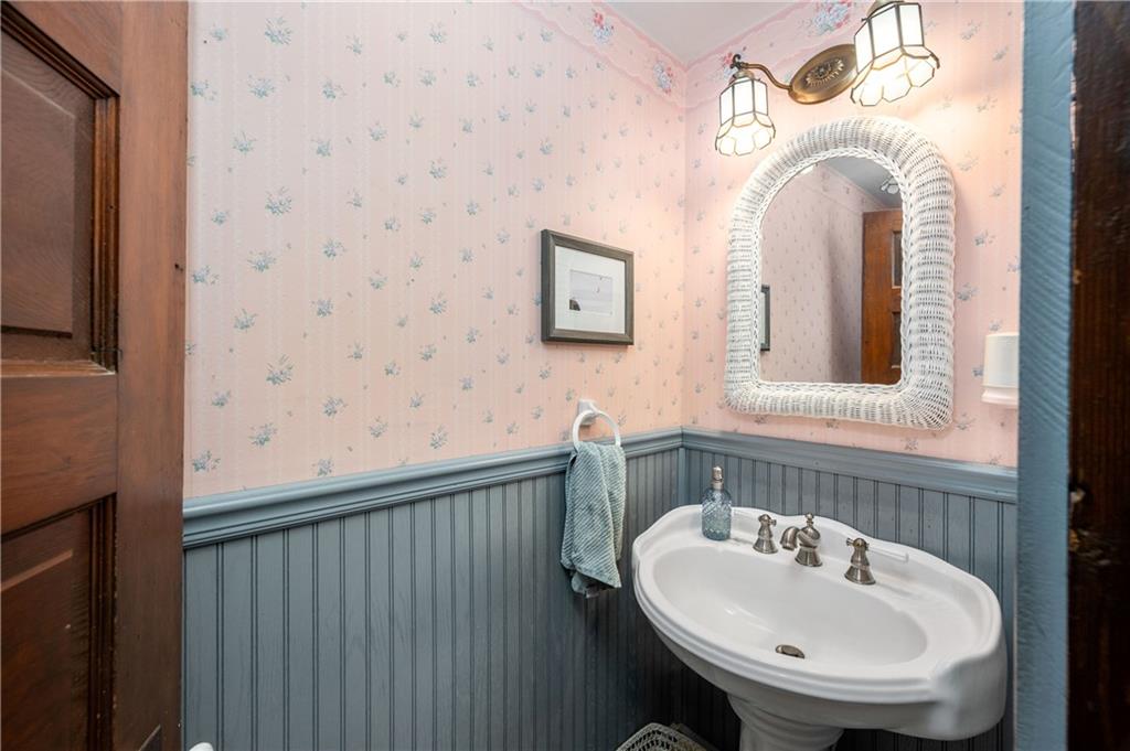 227 Aggas Road West Sunbury, PA 16061 - Photo 29 of 50 a bathroom with a sink and a mirror