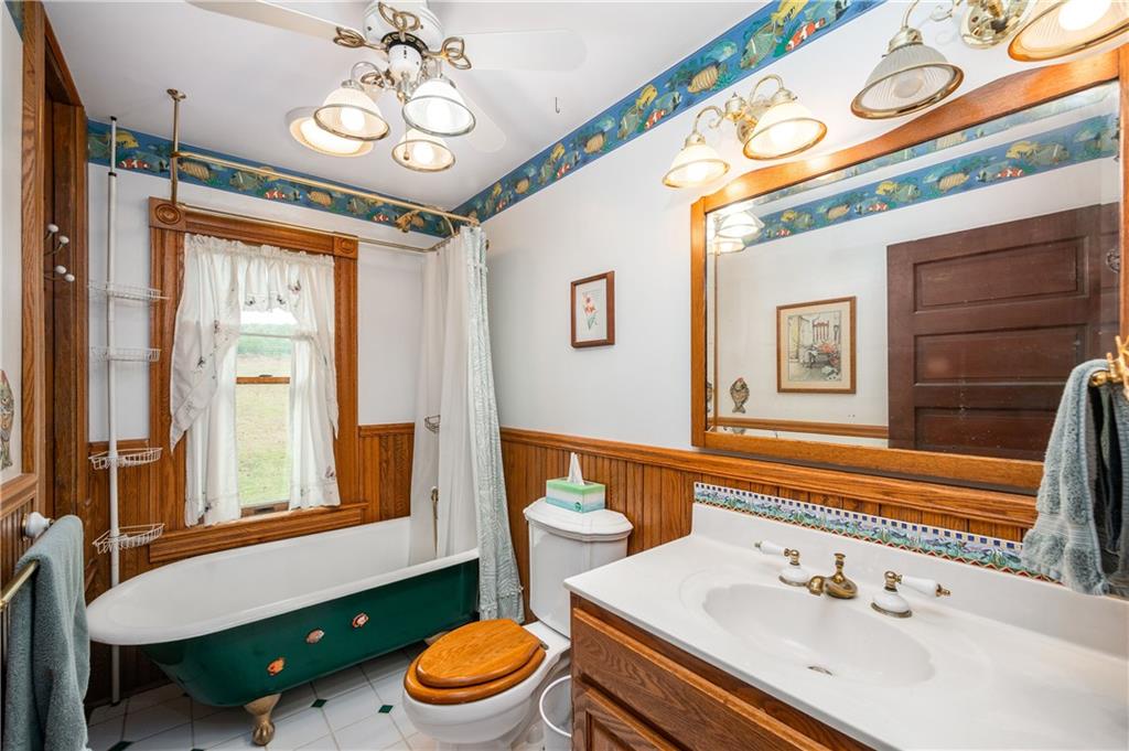 227 Aggas Road West Sunbury, PA 16061 - Photo 38 of 50 a bathroom with a sink a toilet and a mirror