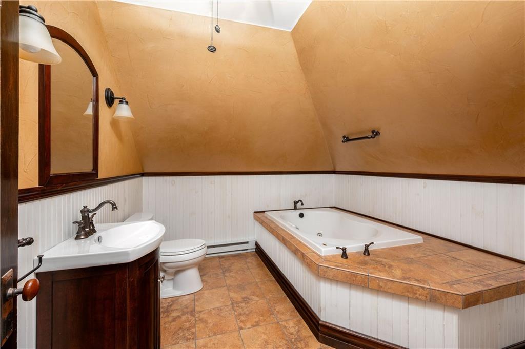 227 Aggas Road West Sunbury, PA 16061 - Photo 42 of 50 a bathroom with a tub sink and mirror