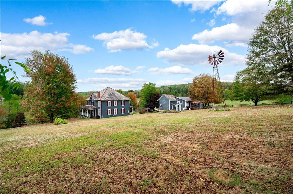 227 Aggas Road West Sunbury, PA 16061 - Photo 43 of 50 a view of a yard with a house