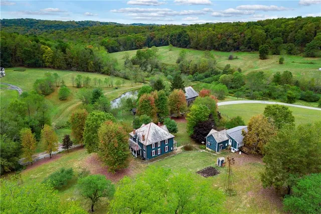 an aerial view of a house with mountain view