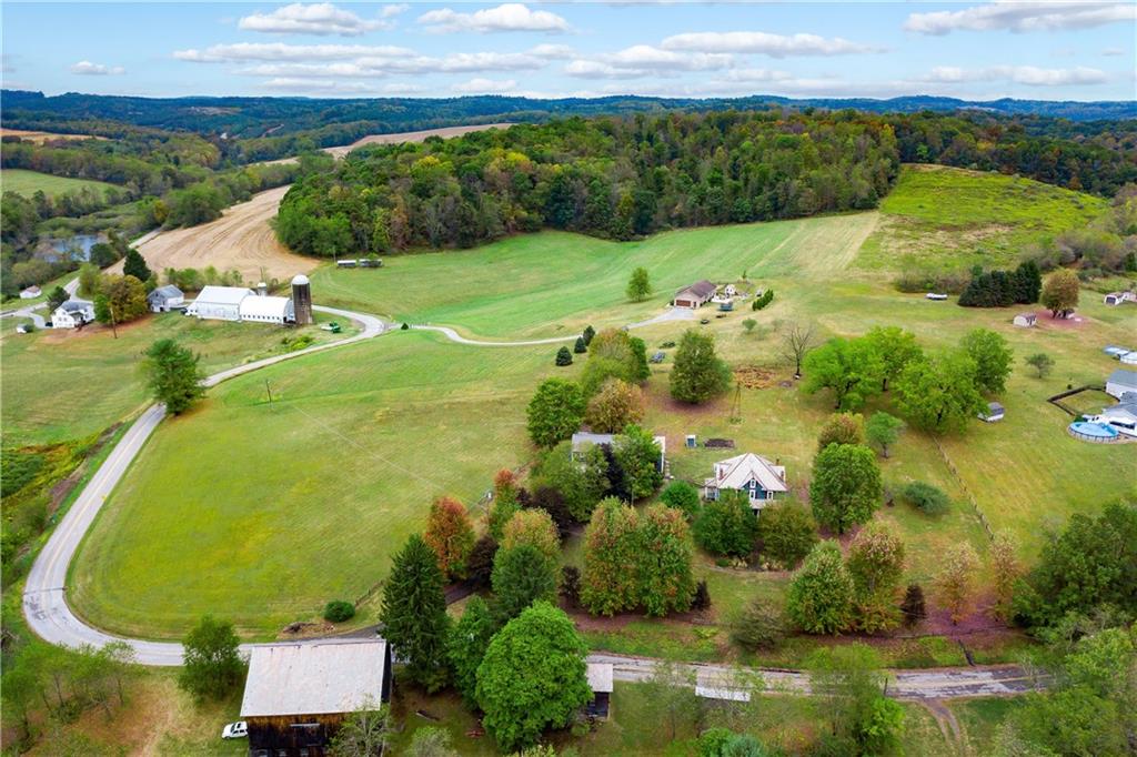 227 Aggas Road West Sunbury, PA 16061 - Photo 48 of 50 an aerial view of a residential houses with outdoor space