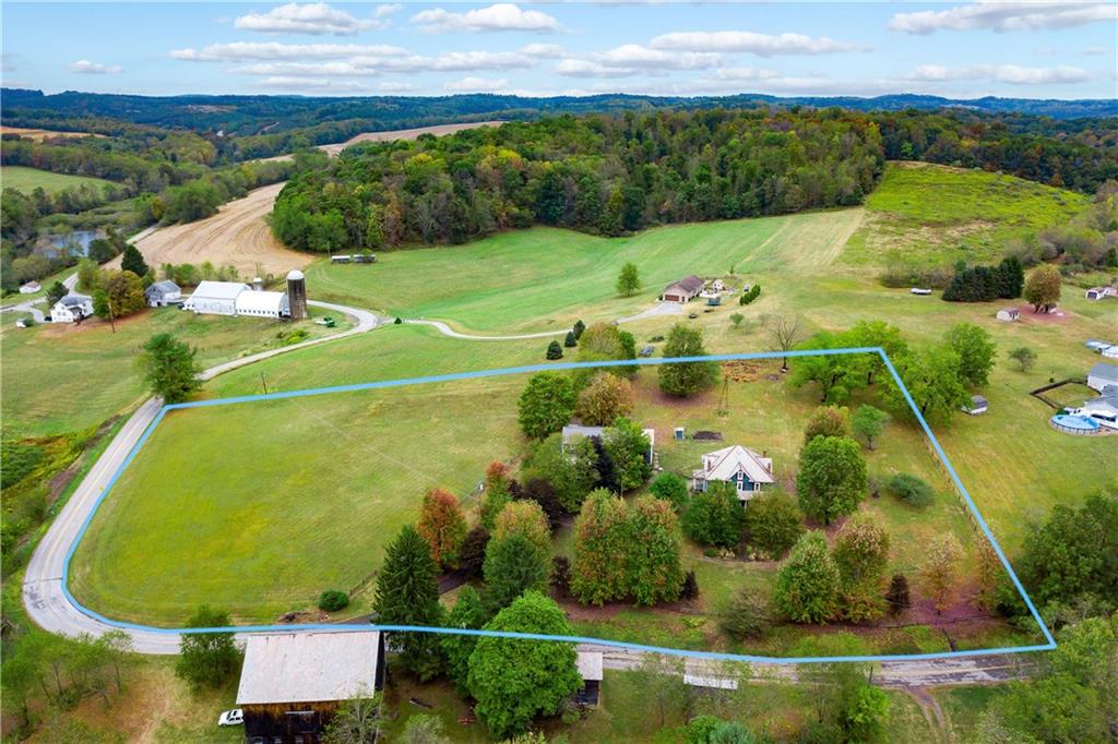 227 Aggas Road West Sunbury, PA 16061 - Photo 49 of 50 an aerial view of a residential houses with outdoor space