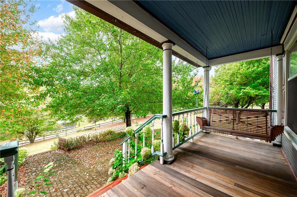 227 Aggas Road West Sunbury, PA 16061 - Photo 6 of 50 a view of a balcony with wooden floor