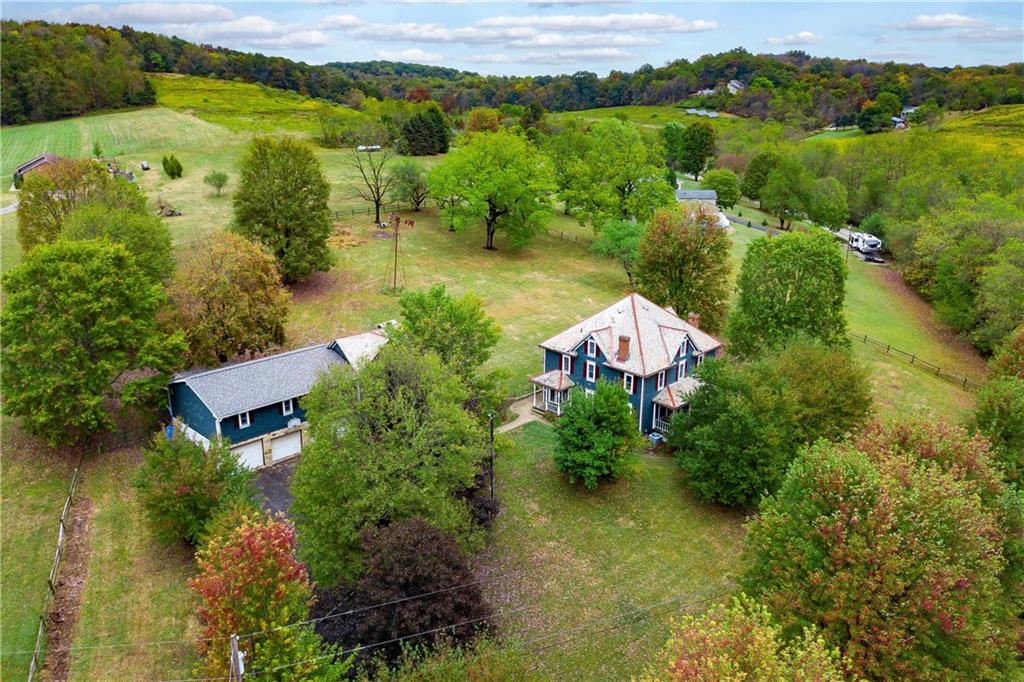 227 Aggas Road West Sunbury, PA 16061 - Photo 9 of 50 an aerial view of a house with a garden and lake view