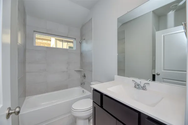 a bathroom with a sink a toilet and a bathtub