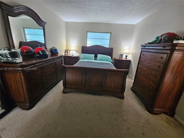 a bedroom with furniture and a fireplace