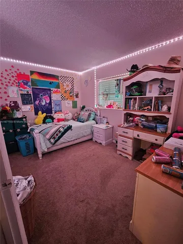 a bed room with a bed and a couch