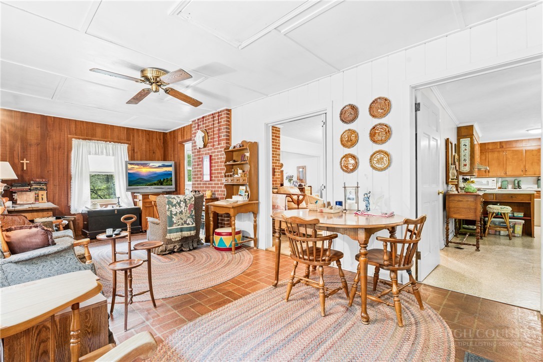 1794 Highway 105 Boone, NC 28607 - Photo 20 of 29 a view of a dining room with furniture window and wooden floor
