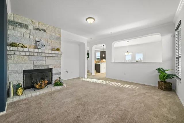 a large bedroom with a bed and a fireplace