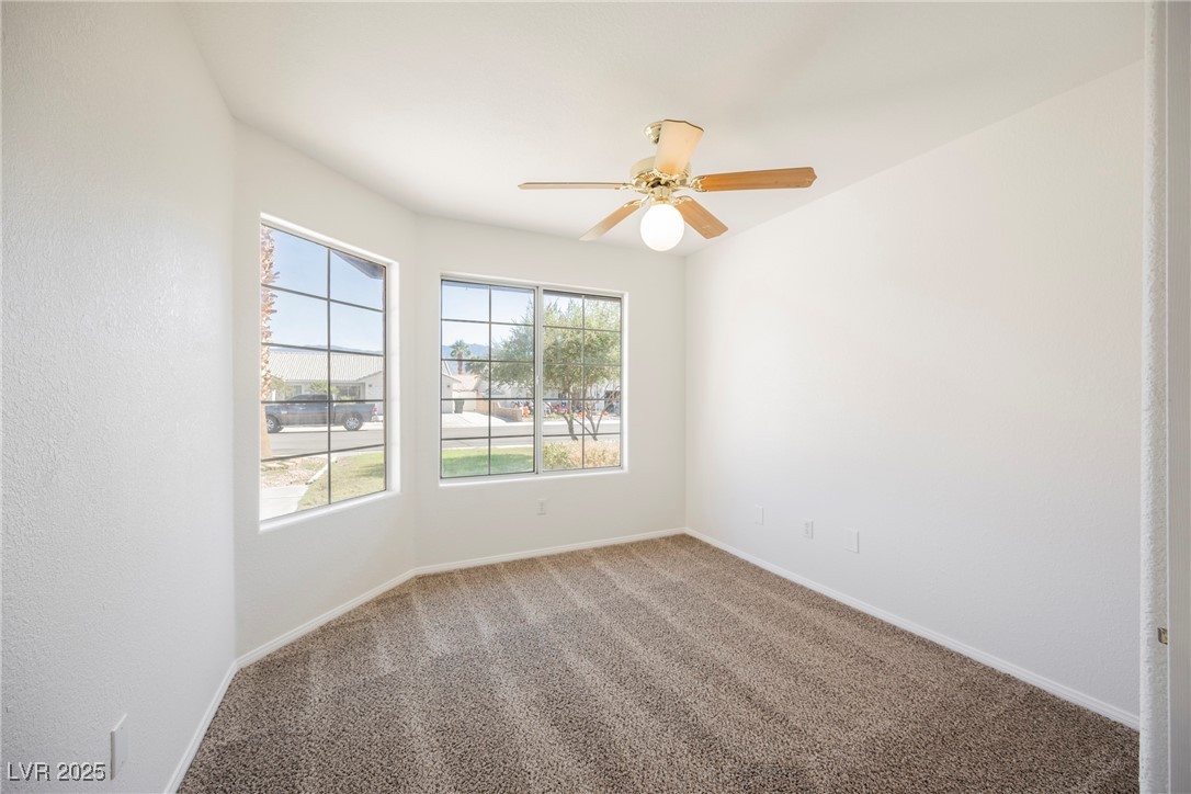 179 Grayce Mesquite, NV 89027 - Photo 15 of 25 Carpeted empty room featuring baseboards and a ceiling fan
