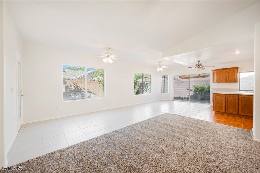 179 Grayce Mesquite, NV 89027 - Photo 4 of 25 Unfurnished living room featuring light tile patterned flooring and a ceiling fan