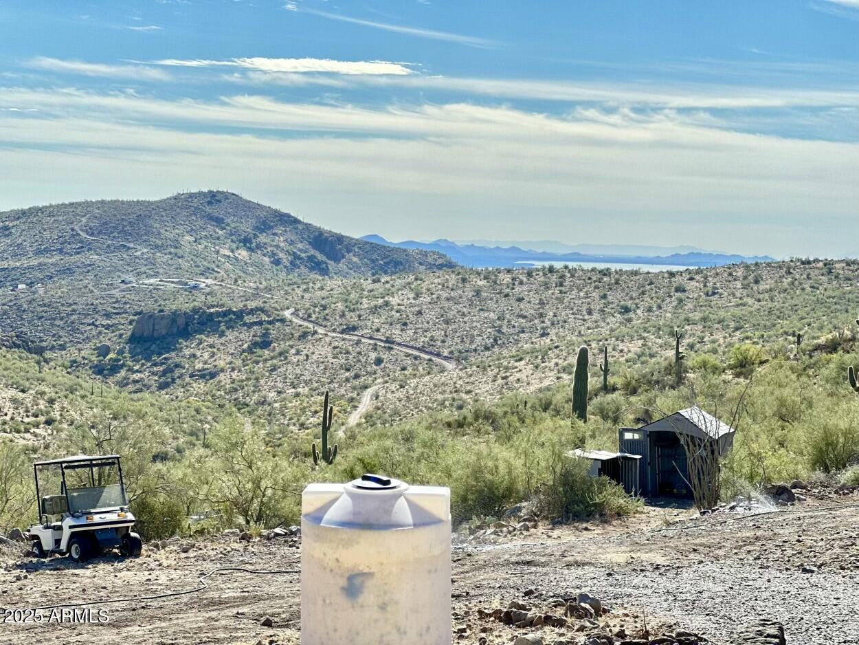 0 South Burro Pass Road, Unit 76 Morristown, AZ 85342 - Photo 14 of 18 a view of a terrace with a water view and mountain view