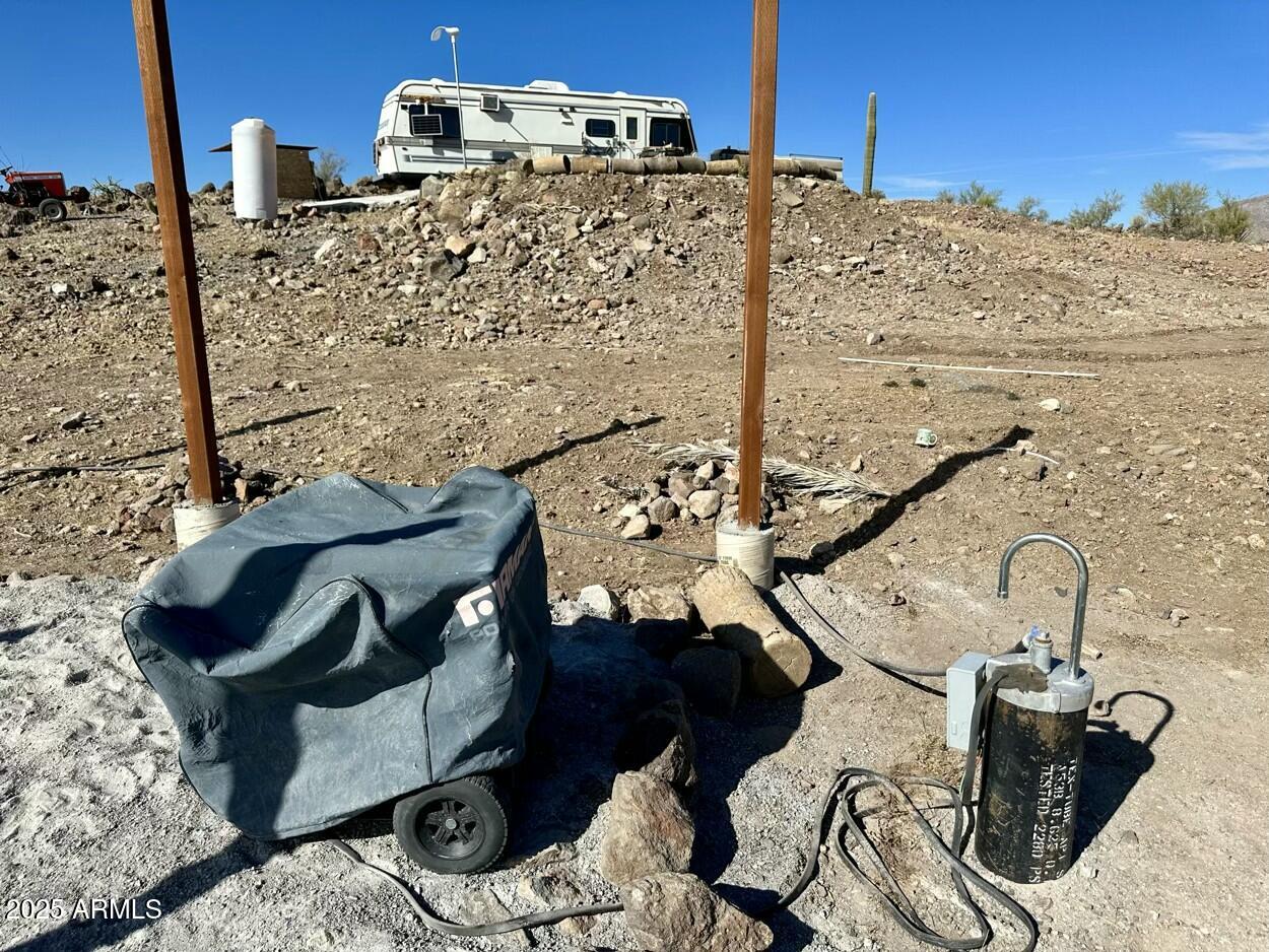 0 South Burro Pass Road, Unit 76 Morristown, AZ 85342 - Photo 7 of 18 a view of a balcony with chairs