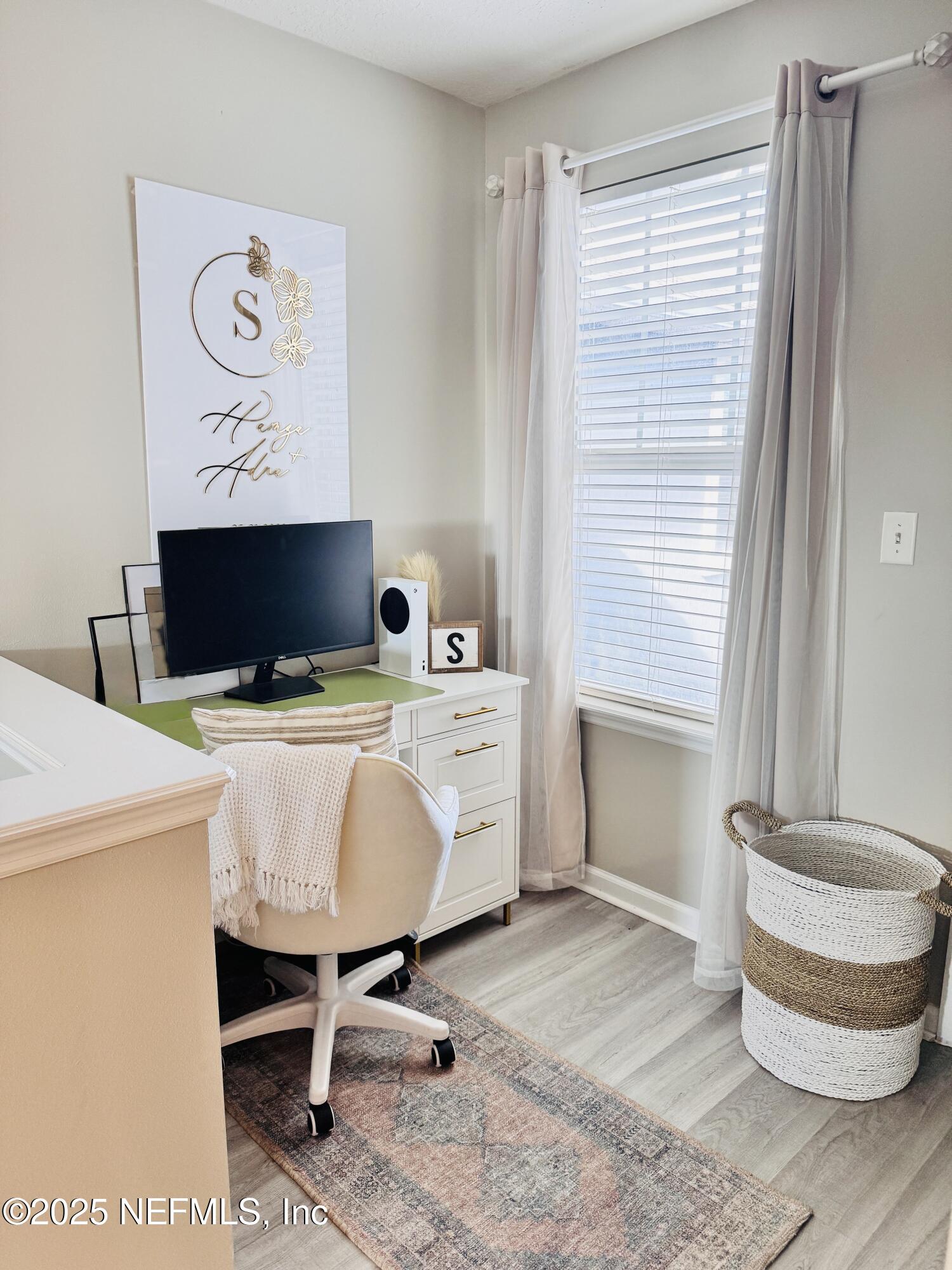 8882 Shell Island Drive Jacksonville, FL 32216 - Photo 11 of 15 a living room with furniture and a window