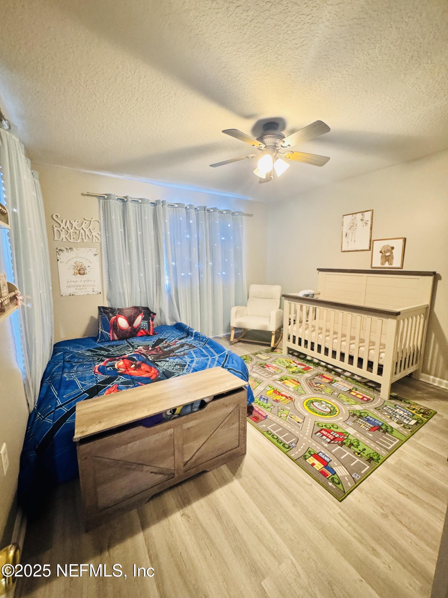 8882 Shell Island Drive Jacksonville, FL 32216 - Photo 15 of 15 a bedroom with a bed and a chandelier