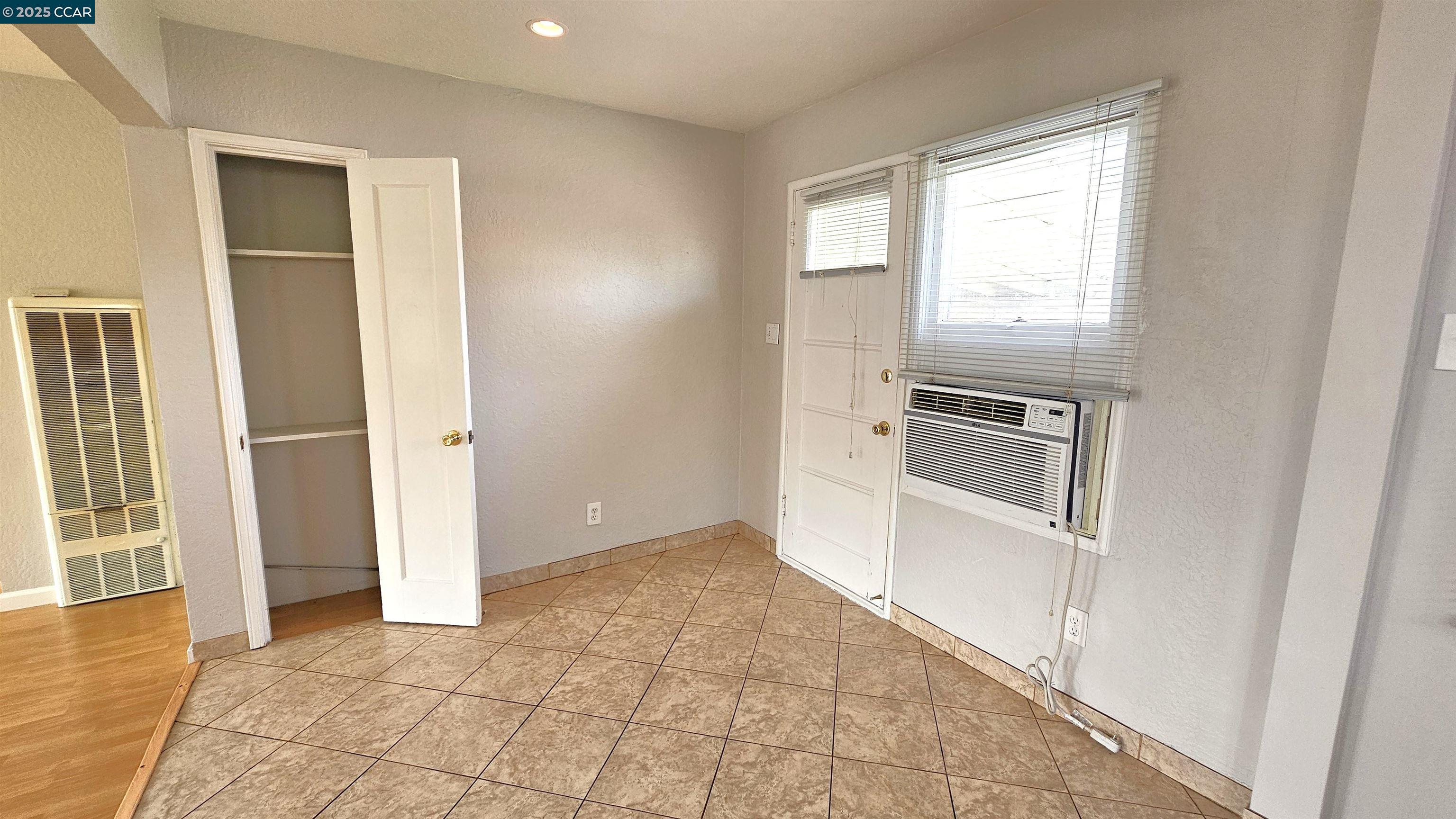 2475 Maple Avenue Concord, CA 94520 - Photo 14 of 28 an entryway with wooden floor and cabinet