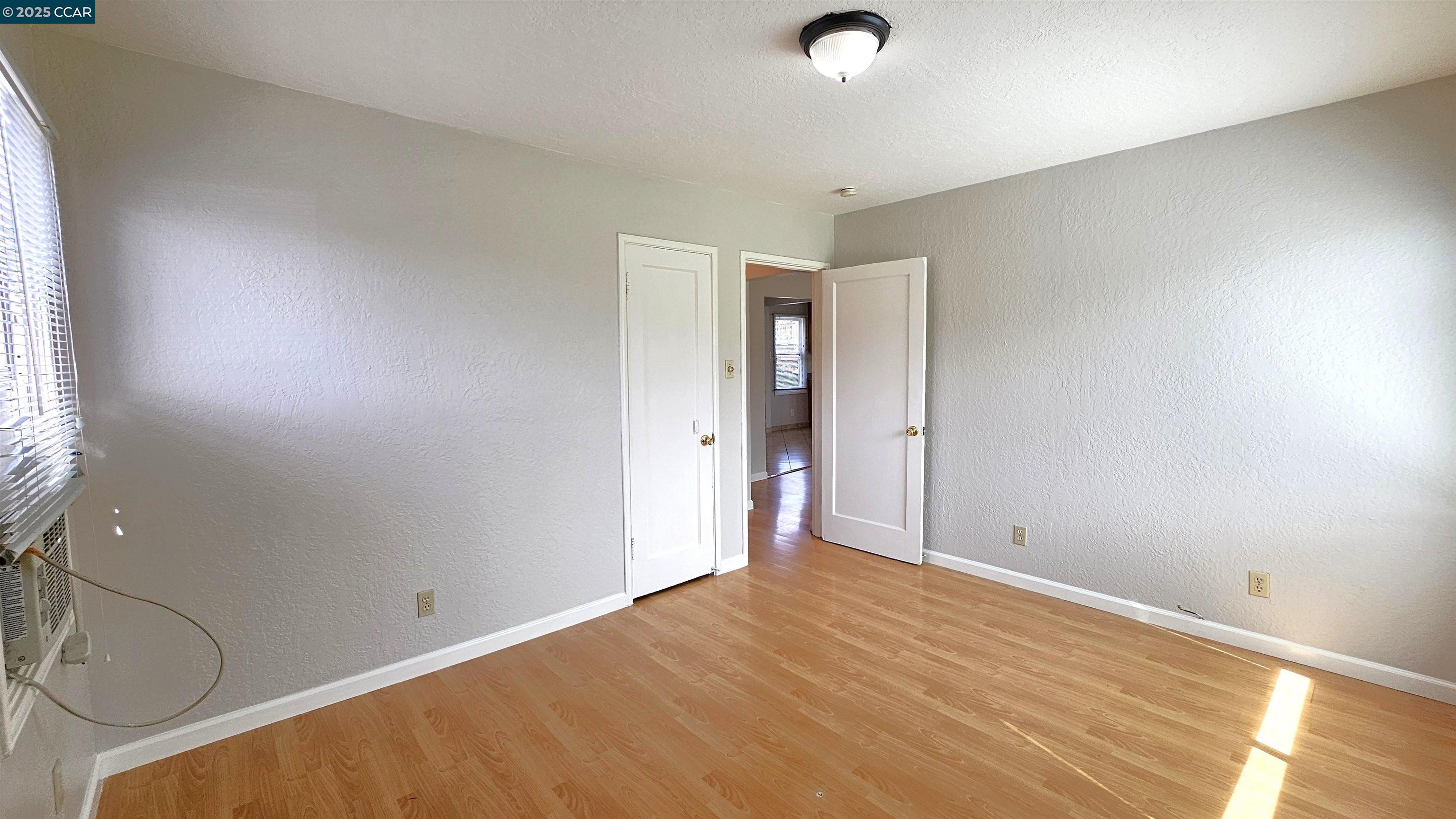 2475 Maple Avenue Concord, CA 94520 - Photo 16 of 28 an empty room with windows and closet