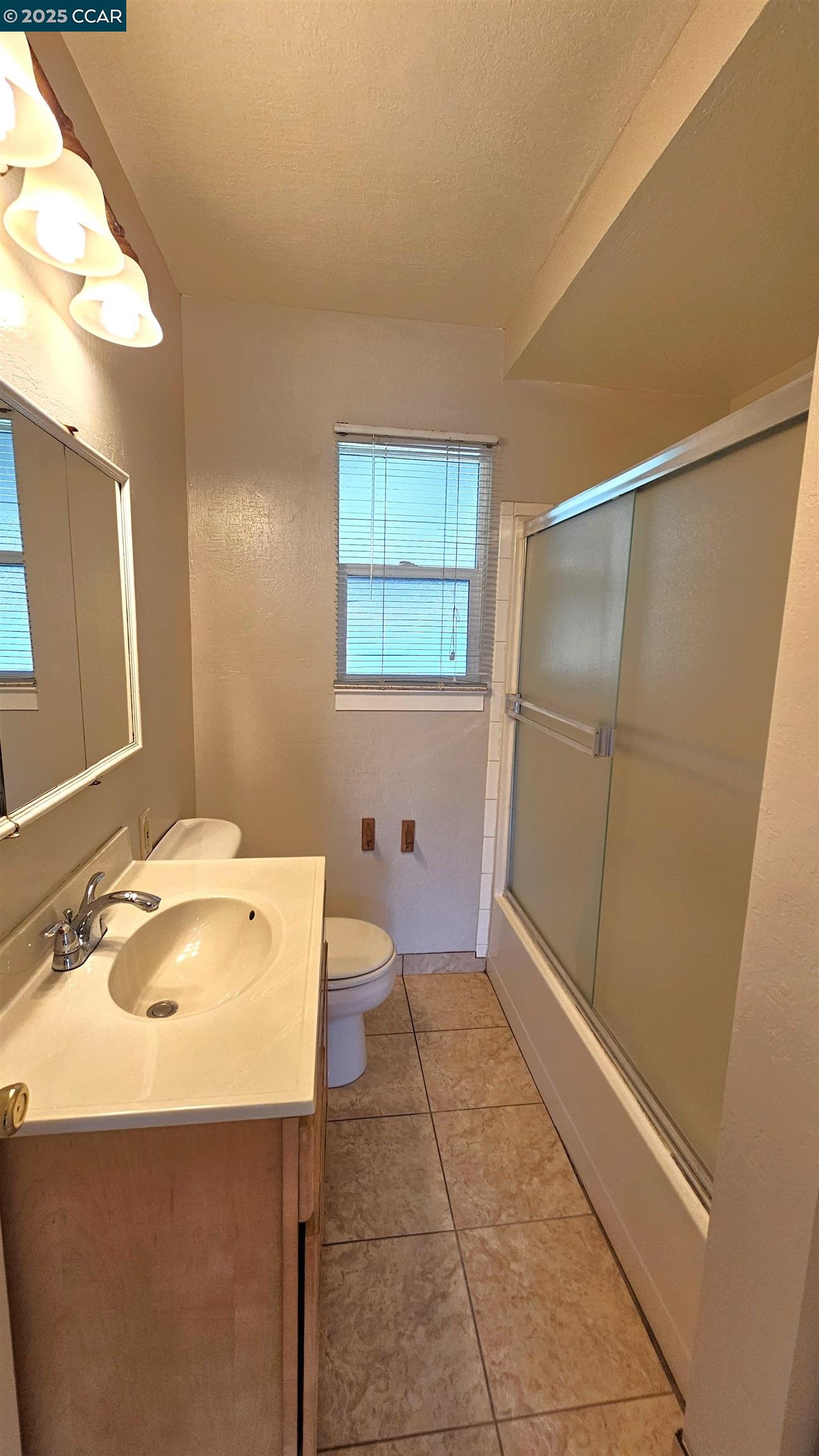 2475 Maple Avenue Concord, CA 94520 - Photo 19 of 28 a bathroom with a sink and a mirror