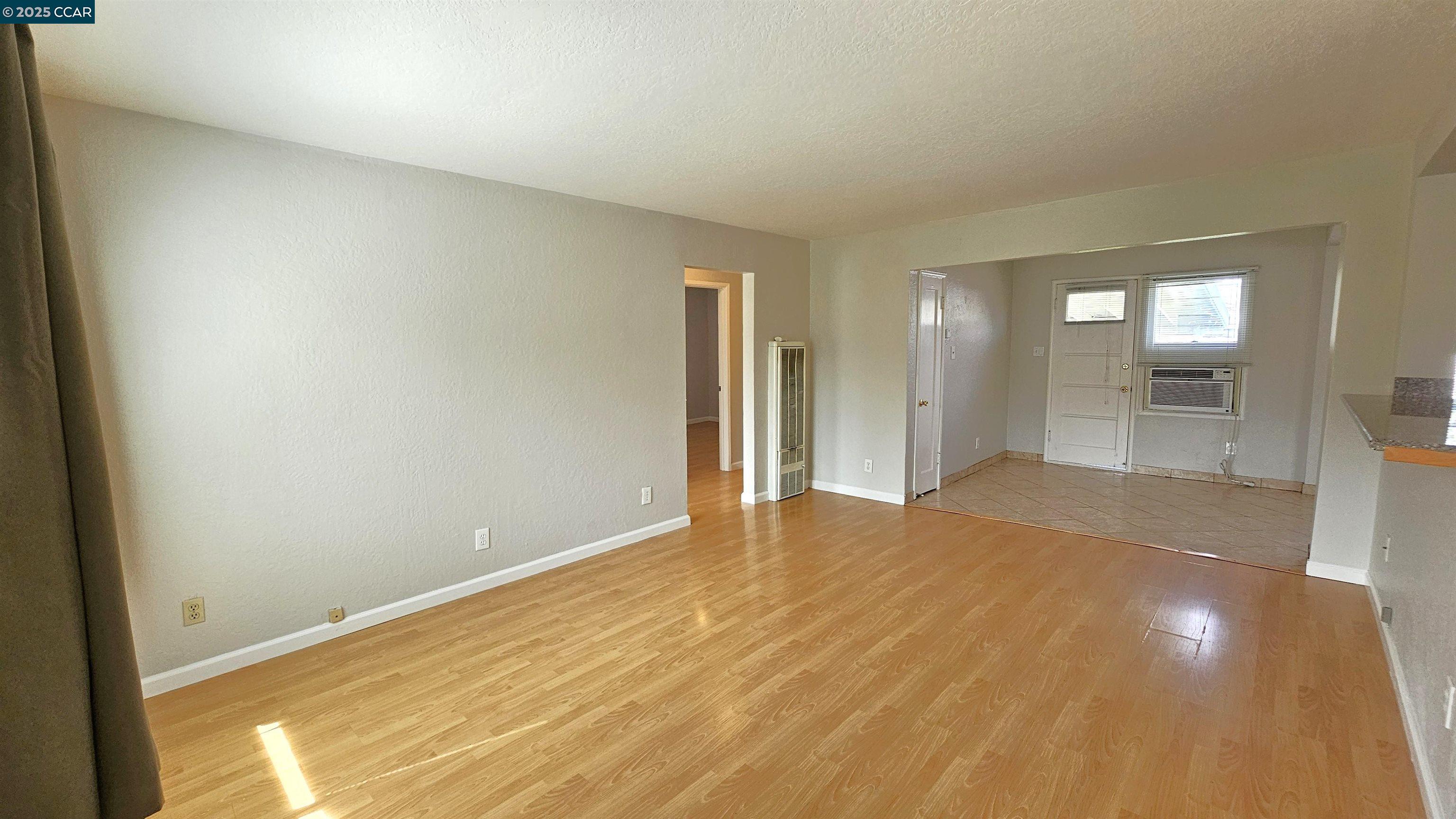 2475 Maple Avenue Concord, CA 94520 - Photo 5 of 28 a view of empty room with wooden floor and windows
