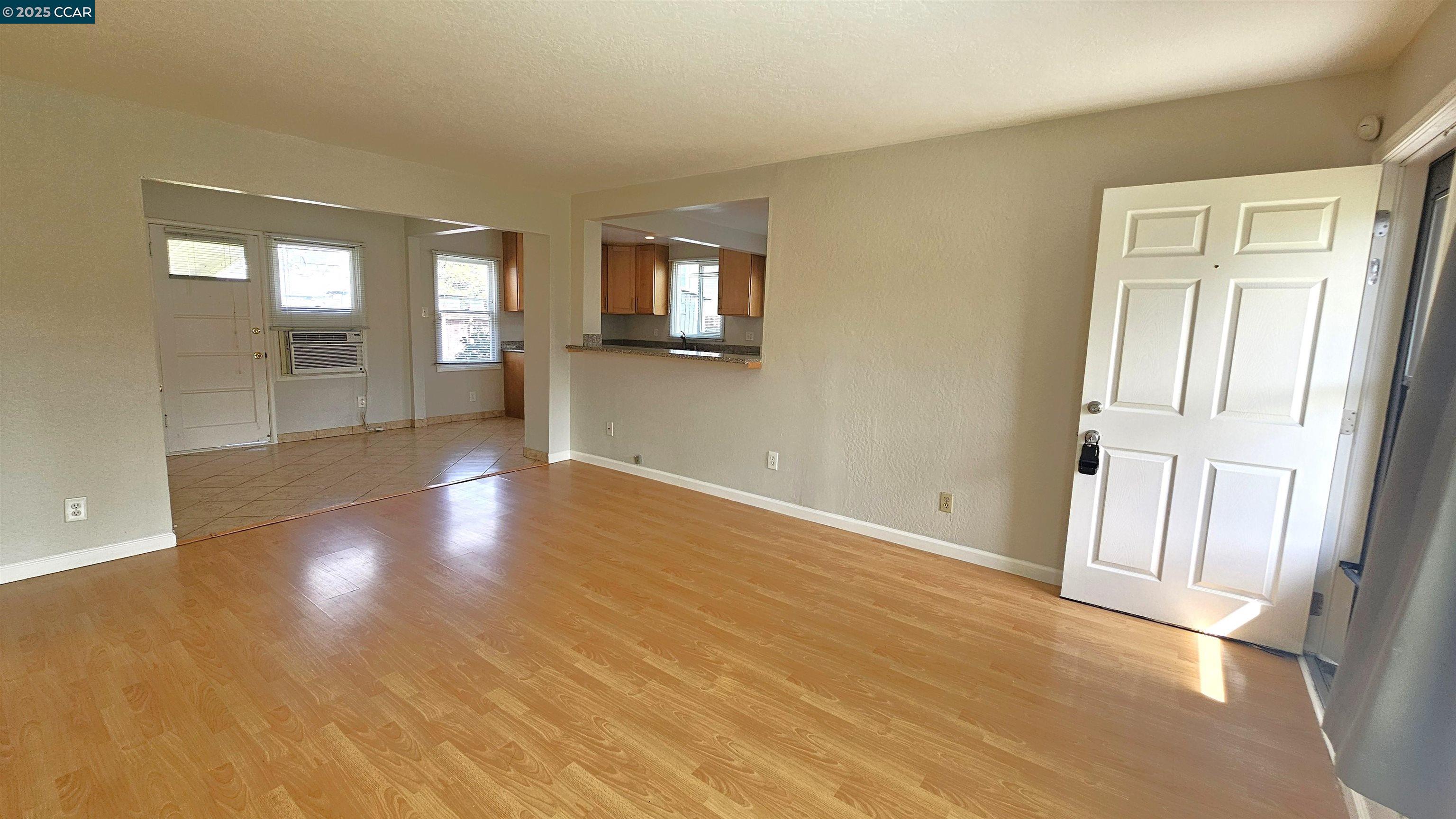2475 Maple Avenue Concord, CA 94520 - Photo 6 of 28 wooden floor in an empty room with a window