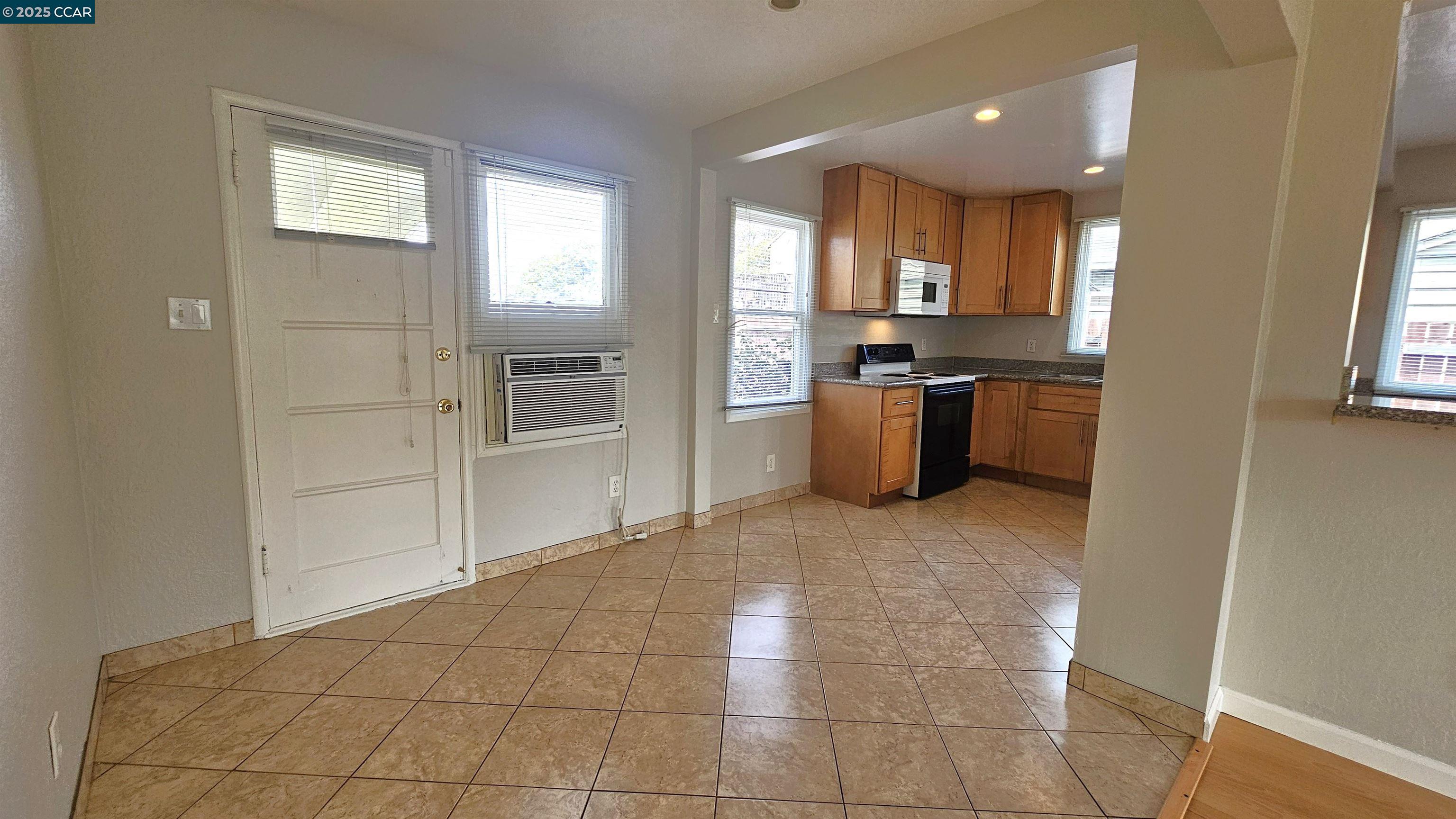 2475 Maple Avenue Concord, CA 94520 - Photo 8 of 28 a large kitchen with a stove a refrigerator and a sink