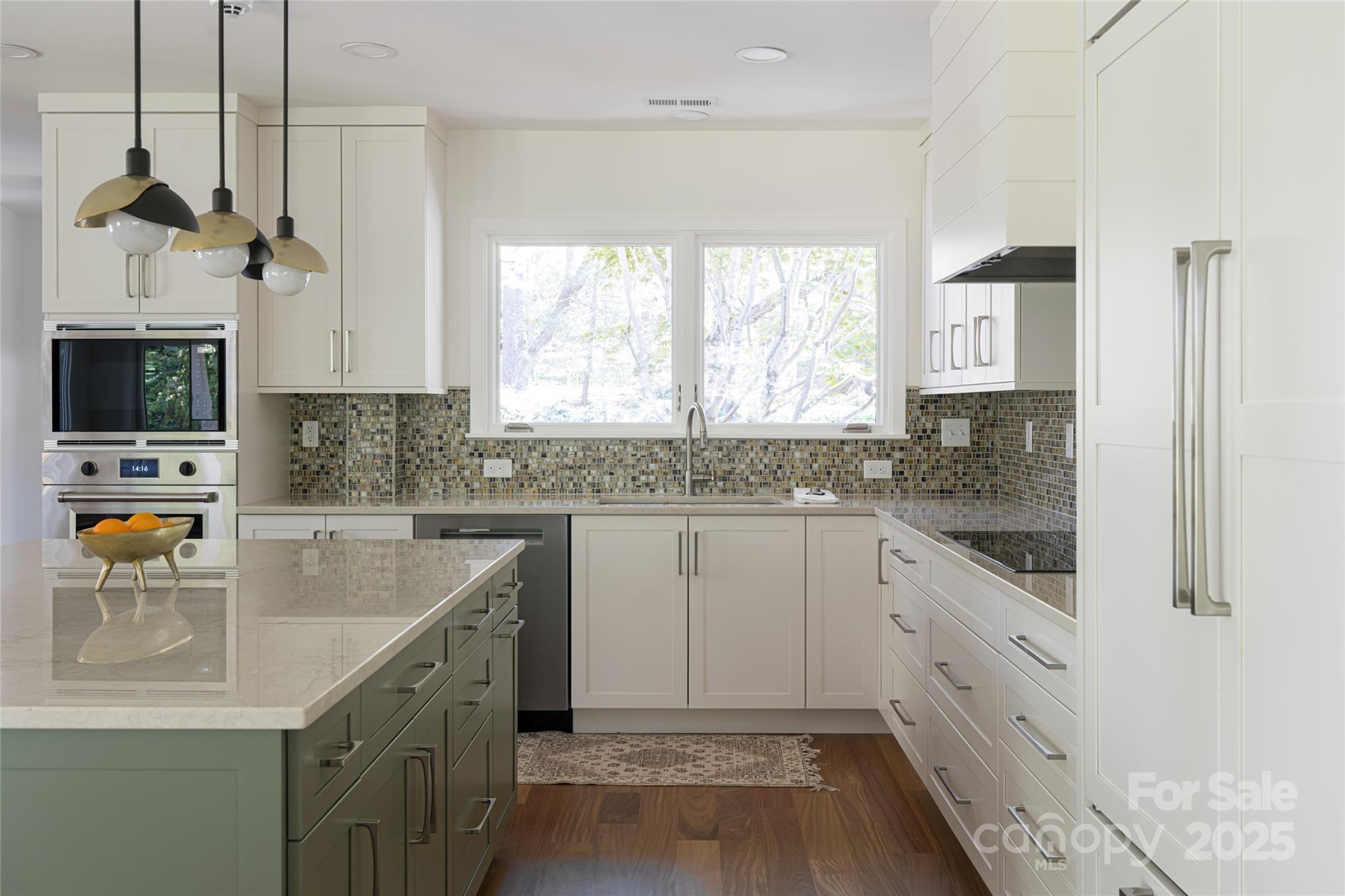5 Holly Hill Road Asheville, NC 28803 - Photo 19 of 33 a kitchen with granite countertop a sink a counter top space cabinets and stainless steel appliances