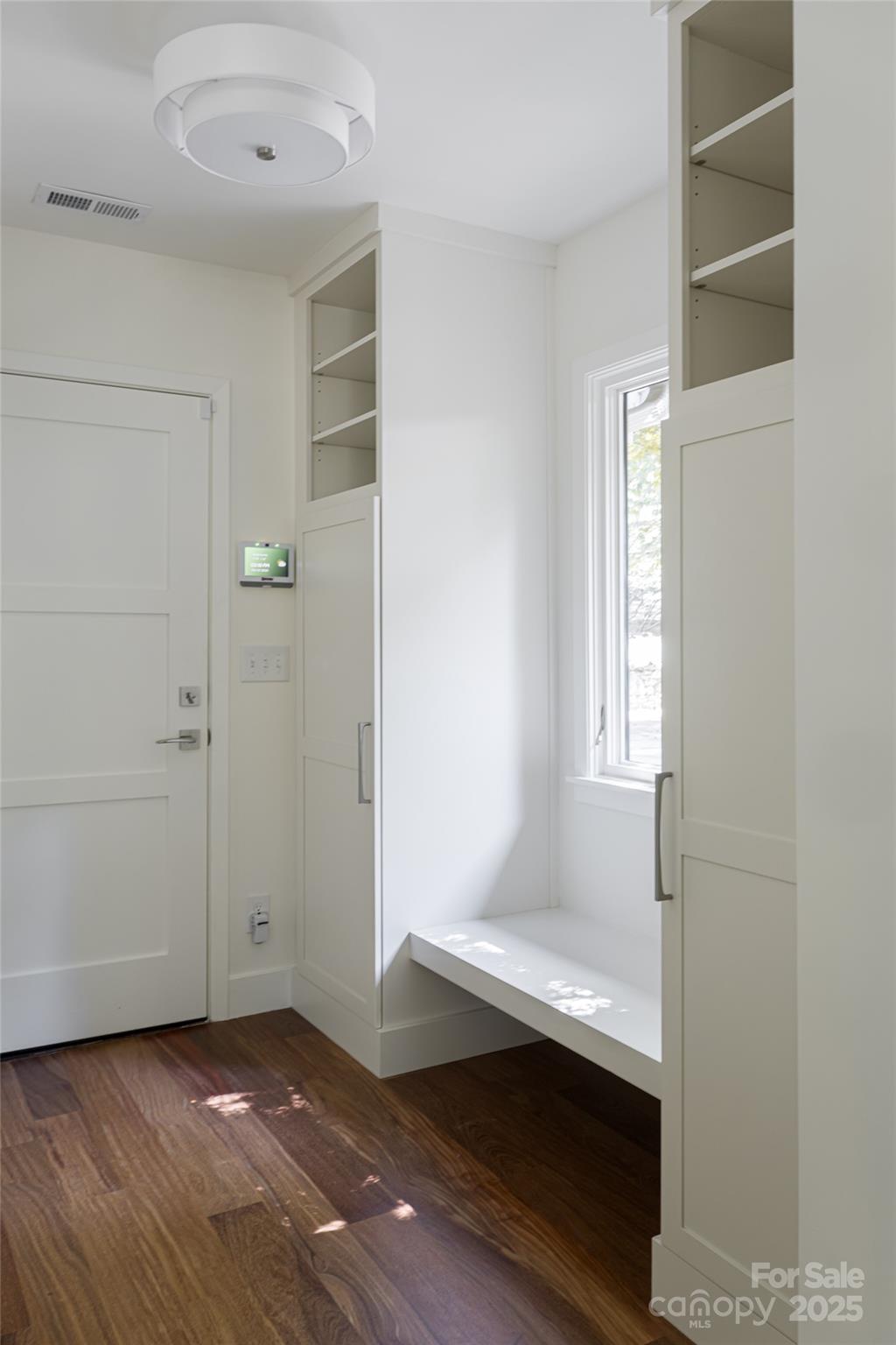 5 Holly Hill Road Asheville, NC 28803 - Photo 20 of 33 an empty room with wooden floor and windows