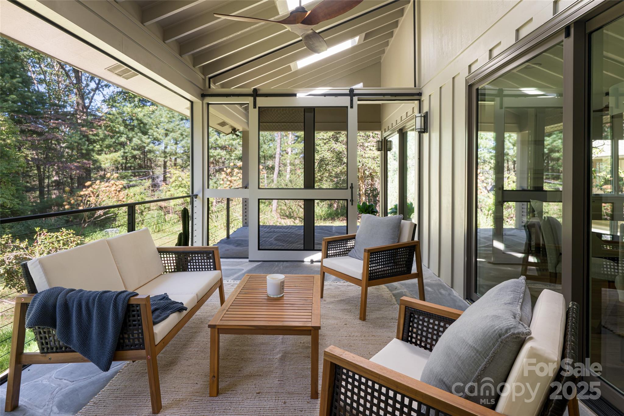 5 Holly Hill Road Asheville, NC 28803 - Photo 21 of 33 a living room with furniture and a floor to ceiling window