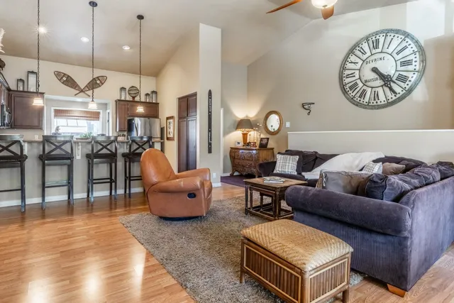 a view of a dining room with furniture and chandelier