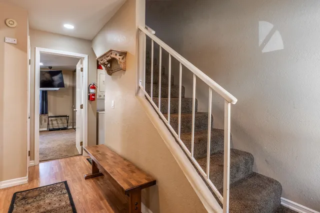 a bedroom with furniture and a window