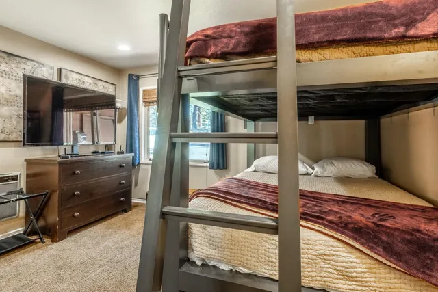 a bed room with a bed and a window