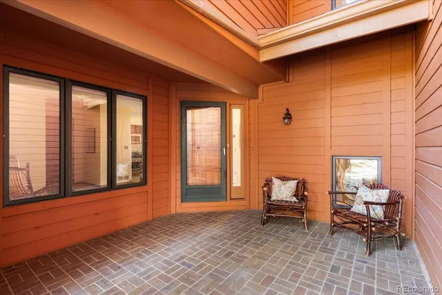 a view of front door with chair and couch