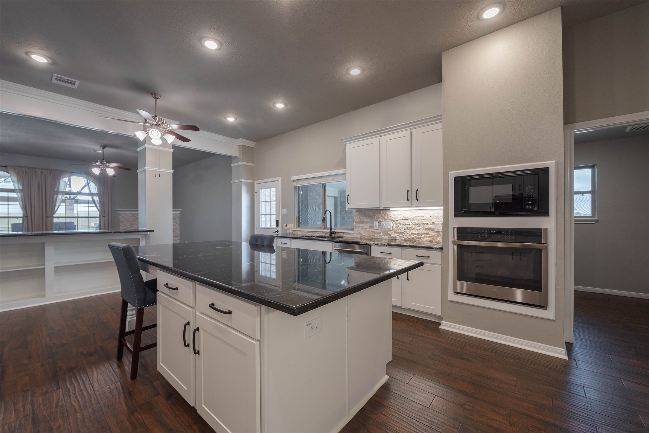 3705 Cabo Road League City, TX 77573 - Photo 12 of 43 a kitchen with stainless steel appliances granite countertop a stove a sink and a refrigerator
