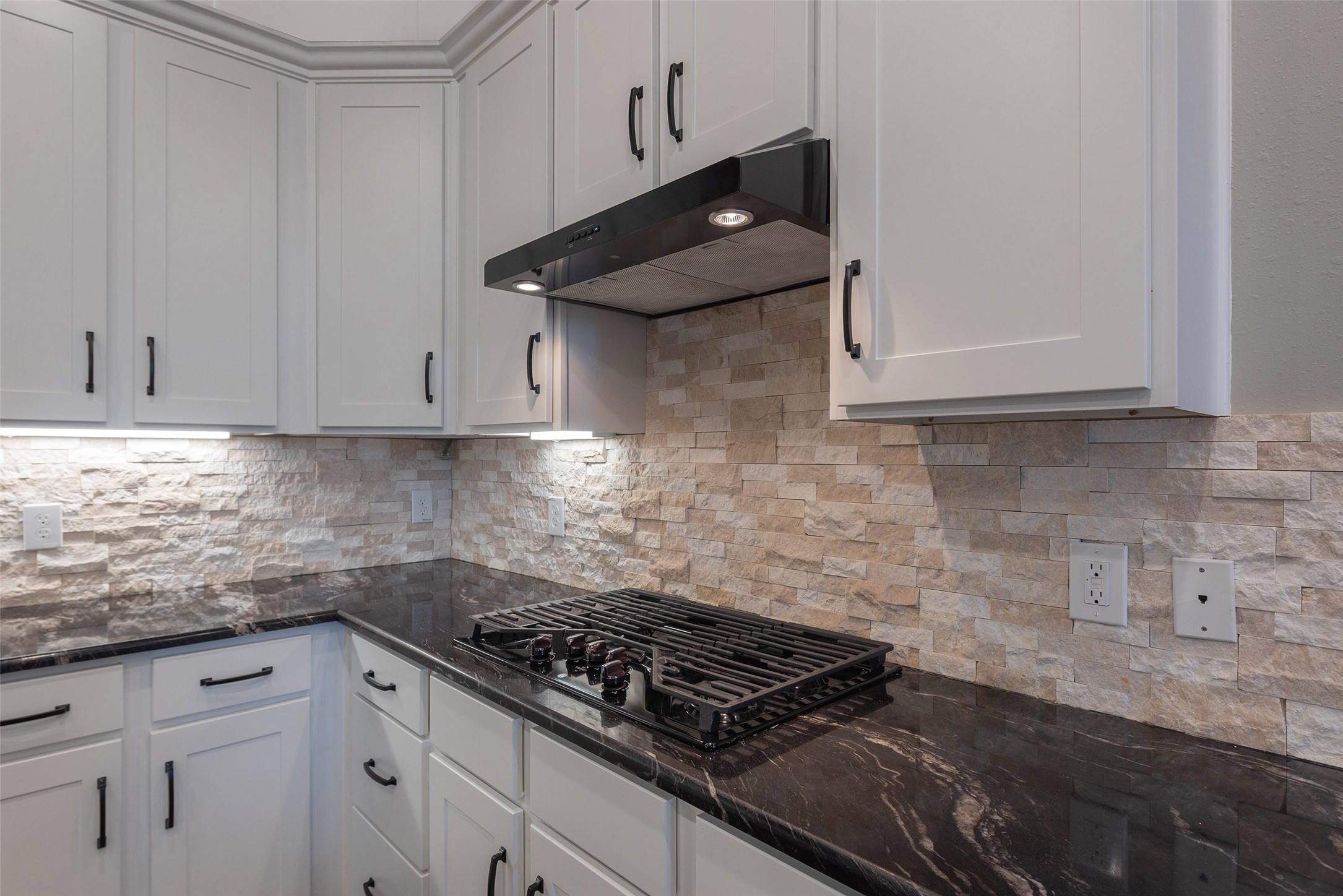 3705 Cabo Road League City, TX 77573 - Photo 13 of 43 a kitchen with granite countertop white cabinets and stainless steel appliances