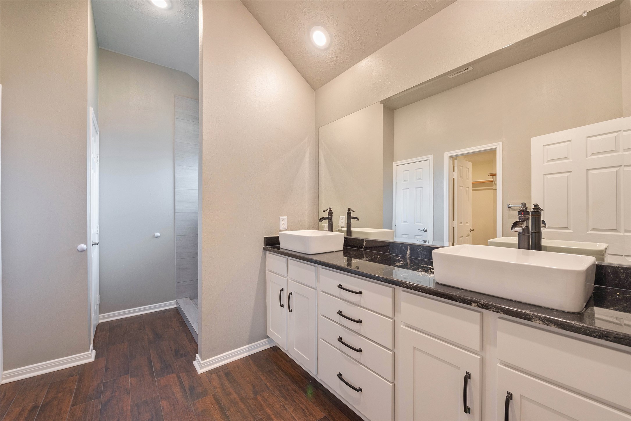 3705 Cabo Road League City, TX 77573 - Photo 19 of 43 a spacious bathroom with a double vanity sink and mirror