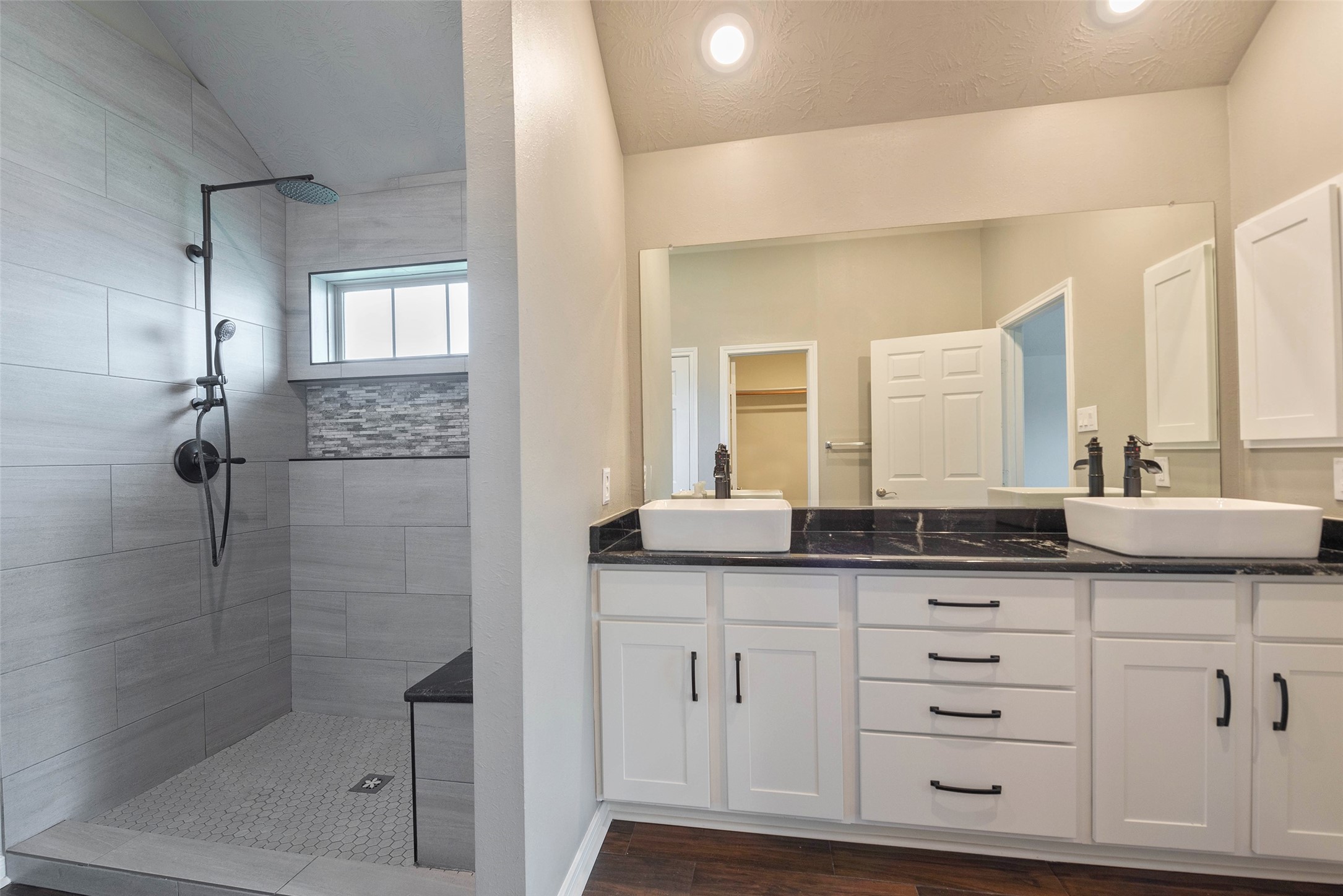3705 Cabo Road League City, TX 77573 - Photo 20 of 43 a bathroom with a granite countertop sink two mirror and shower