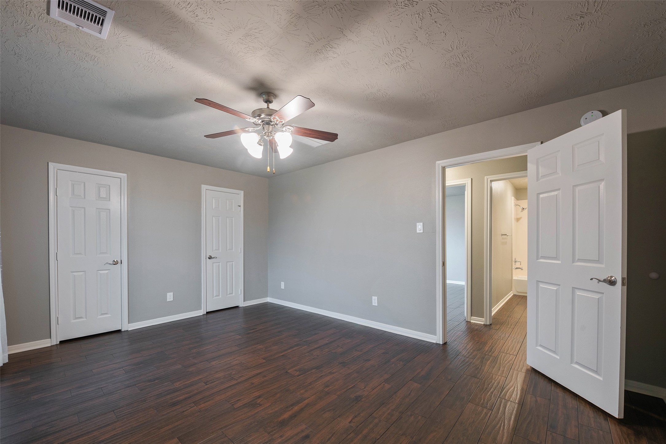3705 Cabo Road League City, TX 77573 - Photo 25 of 43 an empty room with wooden floor and a ceiling fan
