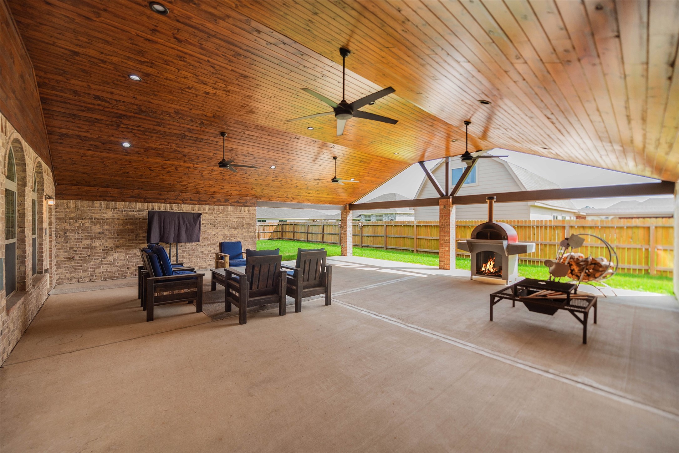 3705 Cabo Road League City, TX 77573 - Photo 33 of 43 a view of a patio with table and chairs under an umbrella