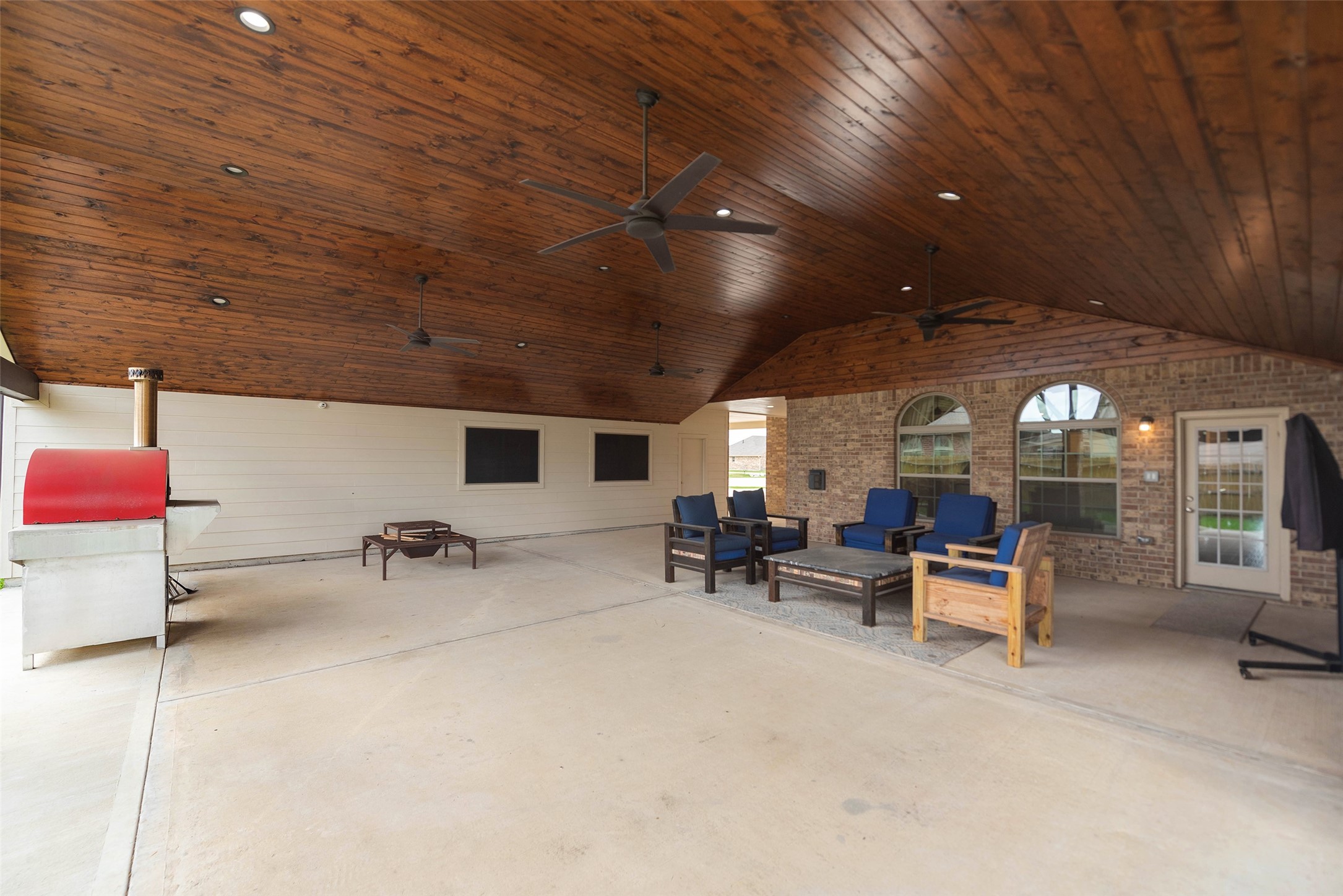 3705 Cabo Road League City, TX 77573 - Photo 34 of 43 a view of a patio with table and chairs and a barbeque