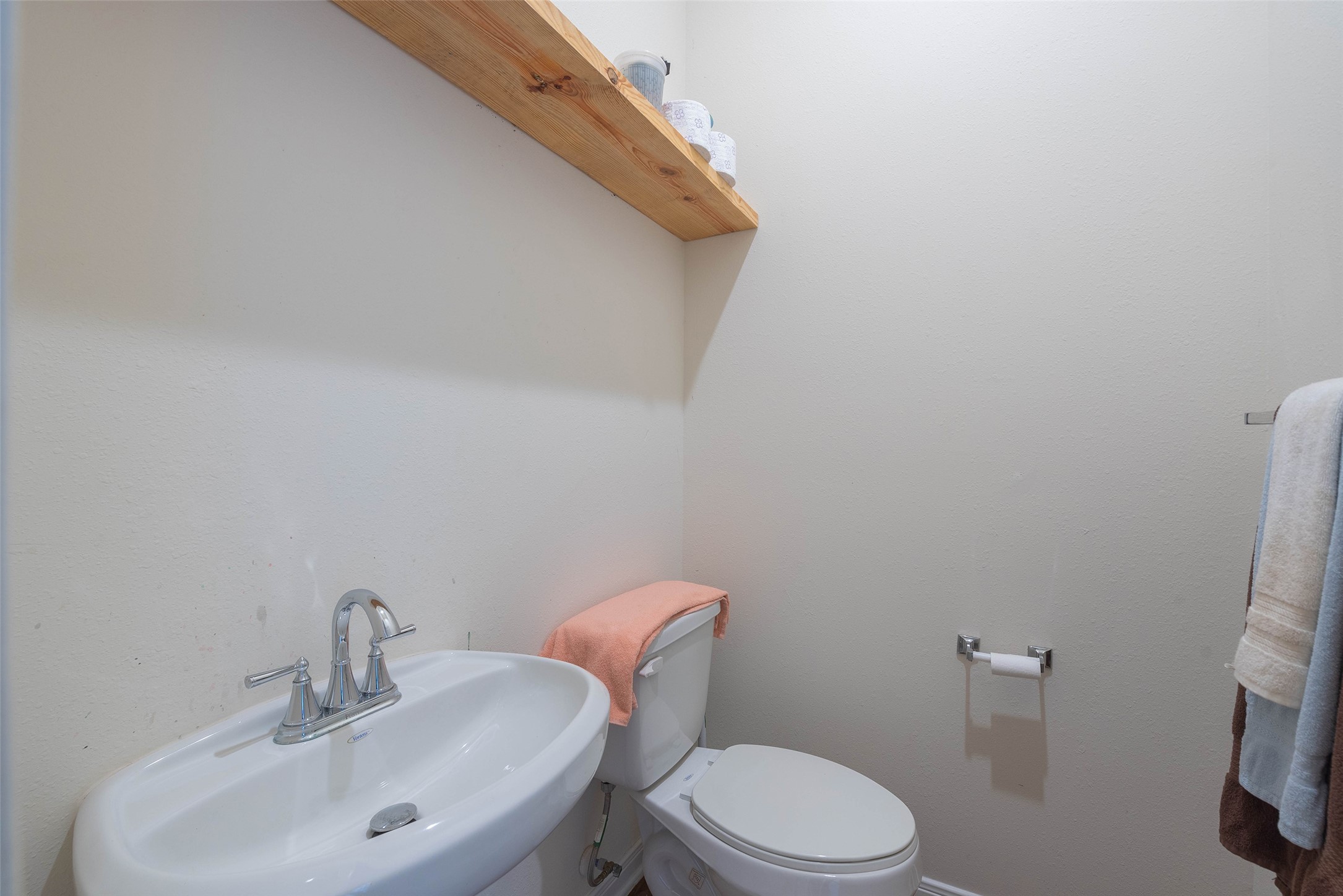 3705 Cabo Road League City, TX 77573 - Photo 39 of 43 a white toilet sitting next to a bathroom sink