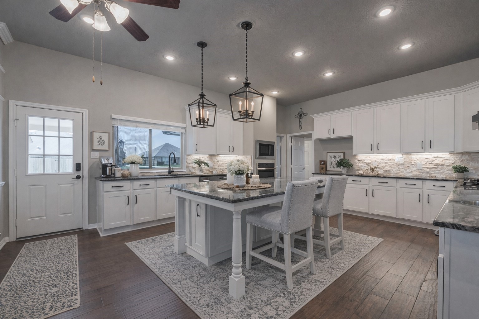 3705 Cabo Road League City, TX 77573 - Photo 9 of 43 a kitchen with kitchen island granite countertop a sink a center island and cabinets