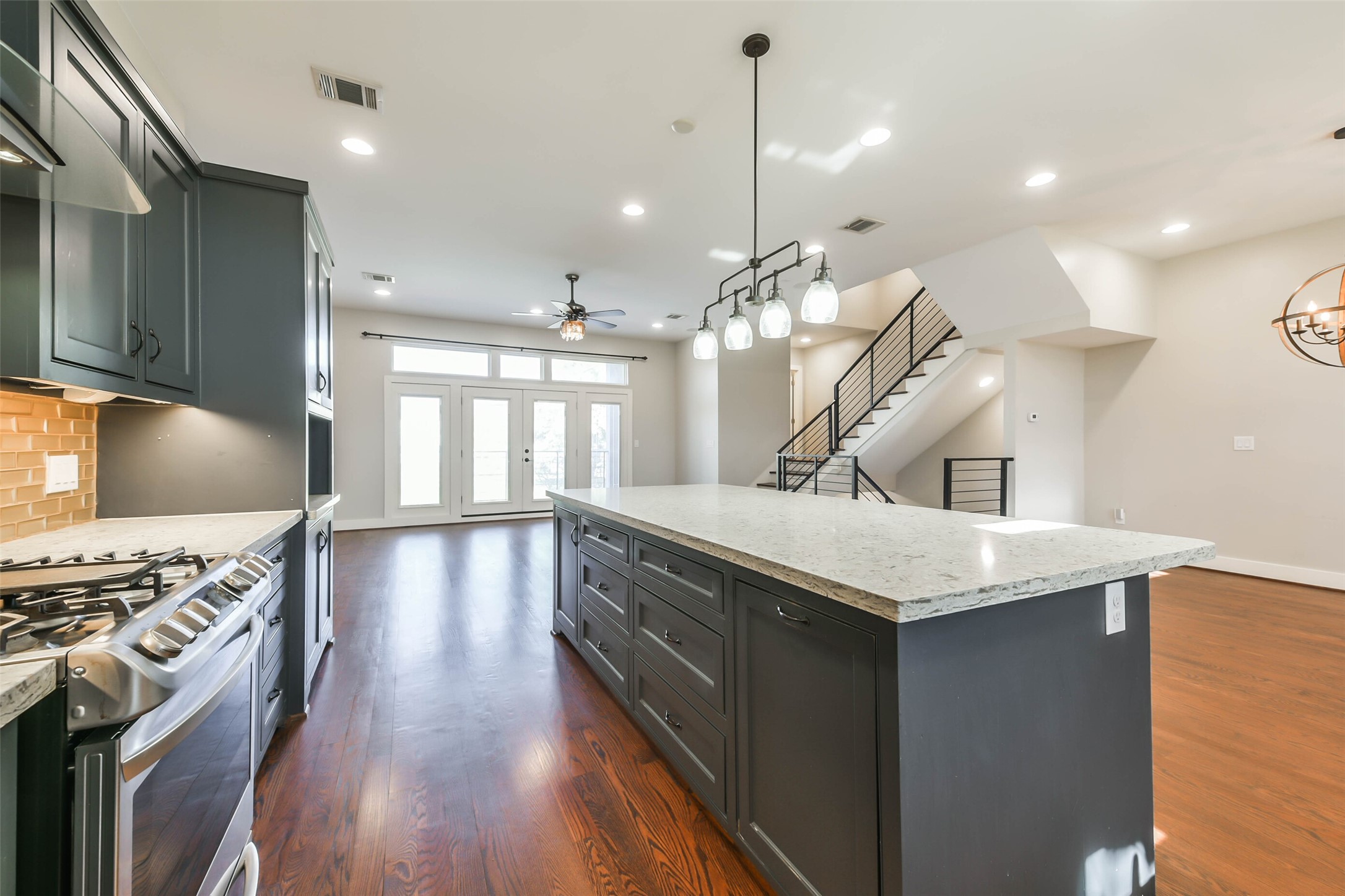 2422 Hadley Street Houston, TX 77004 - Photo 13 of 50 a kitchen with stainless steel appliances granite countertop a sink a stove and a wooden floors