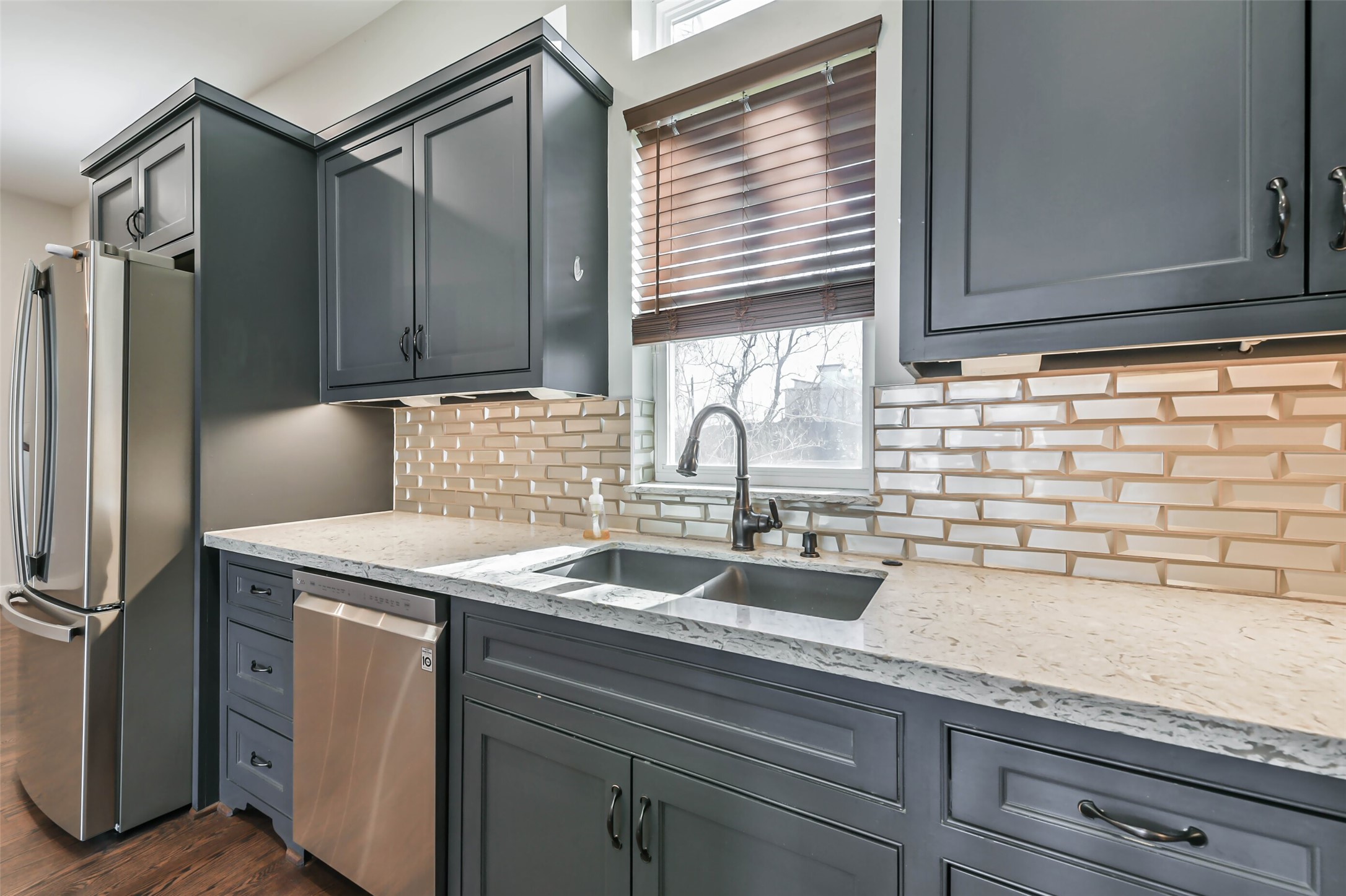 2422 Hadley Street Houston, TX 77004 - Photo 15 of 50 a kitchen with a sink cabinets and stainless steel appliances