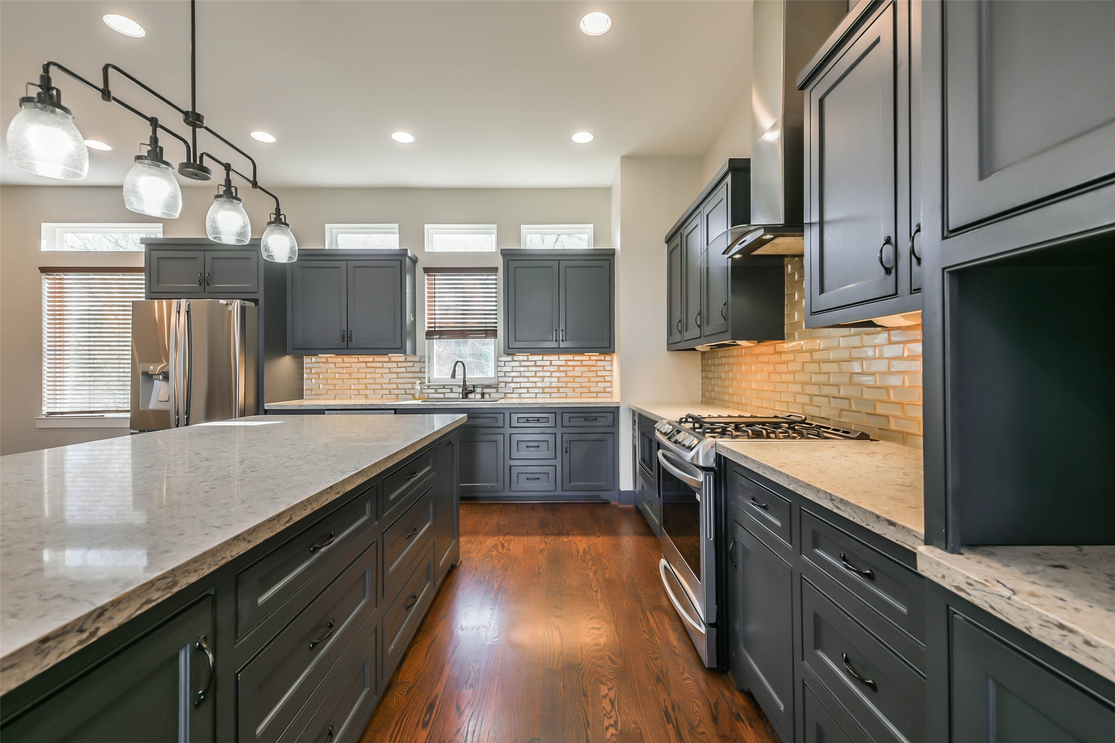 2422 Hadley Street Houston, TX 77004 - Photo 17 of 50 a large kitchen with stainless steel appliances granite countertop a lot of counter space