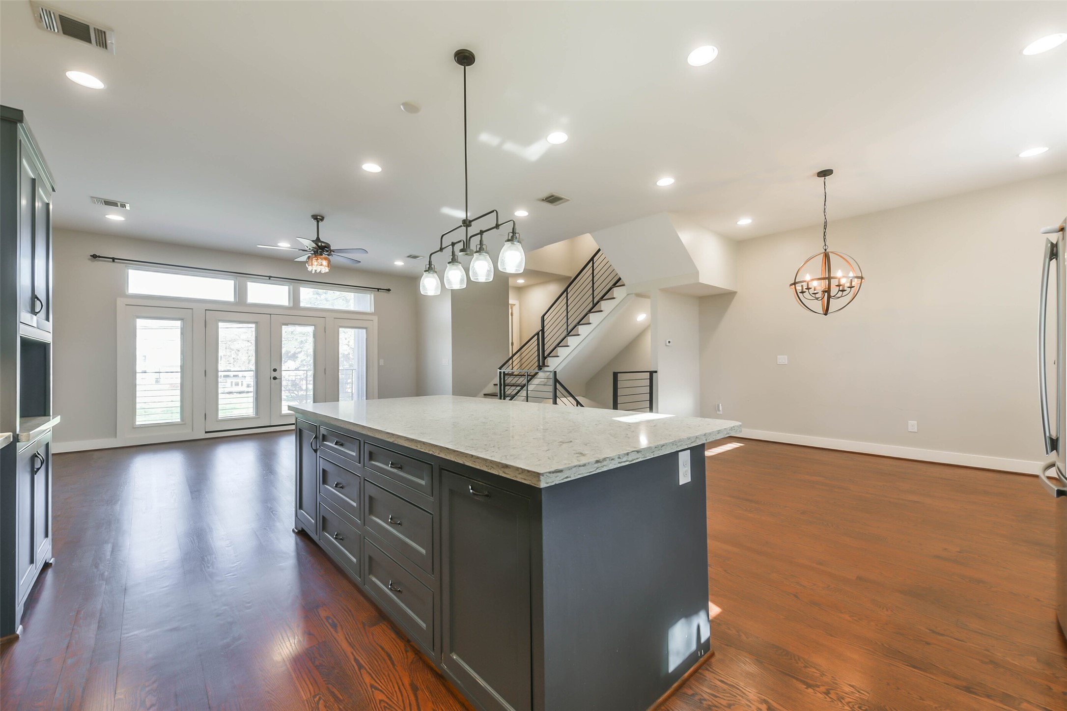 2422 Hadley Street Houston, TX 77004 - Photo 20 of 50 a kitchen with a sink a chandelier and wooden floor